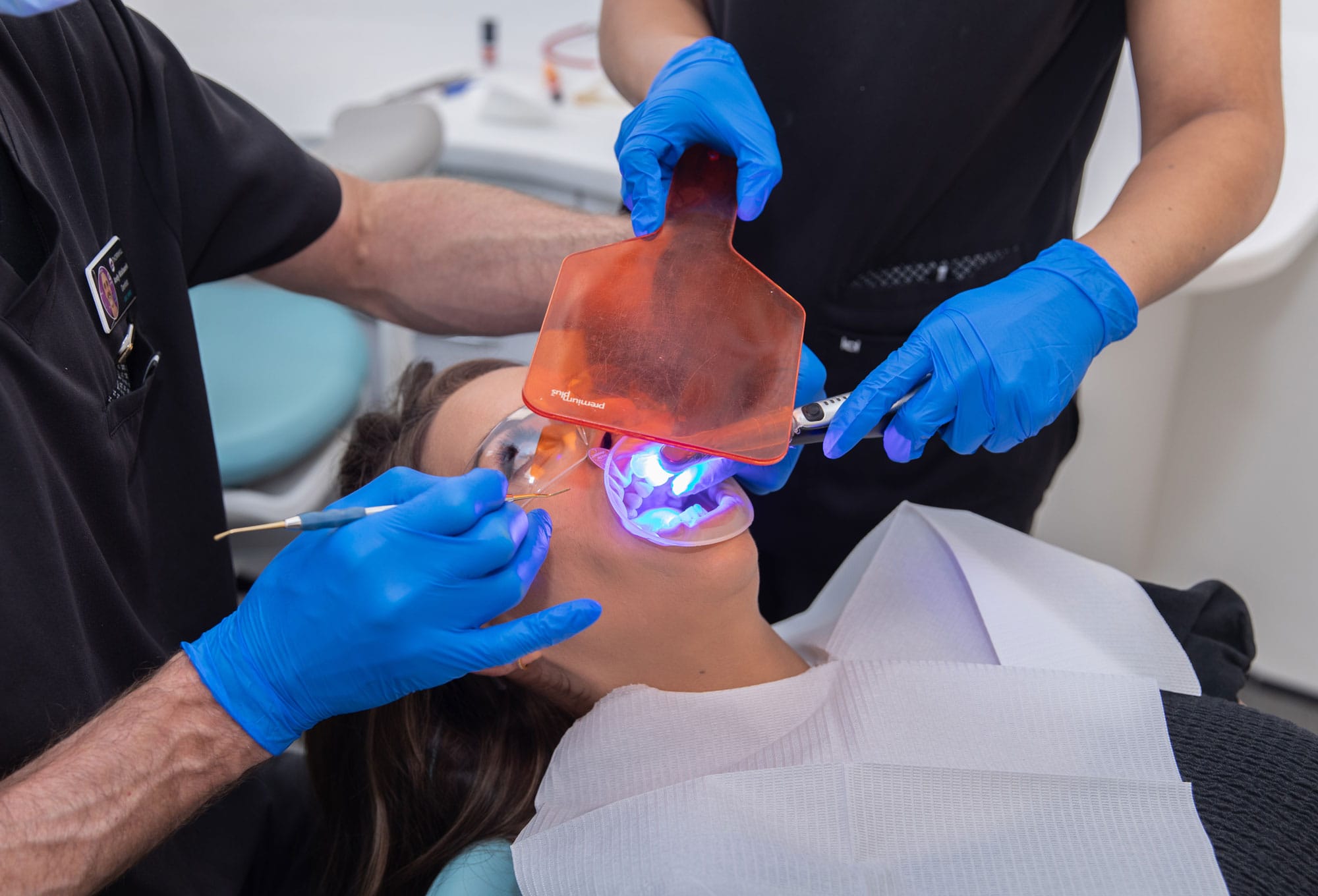 Dentist is using UV light