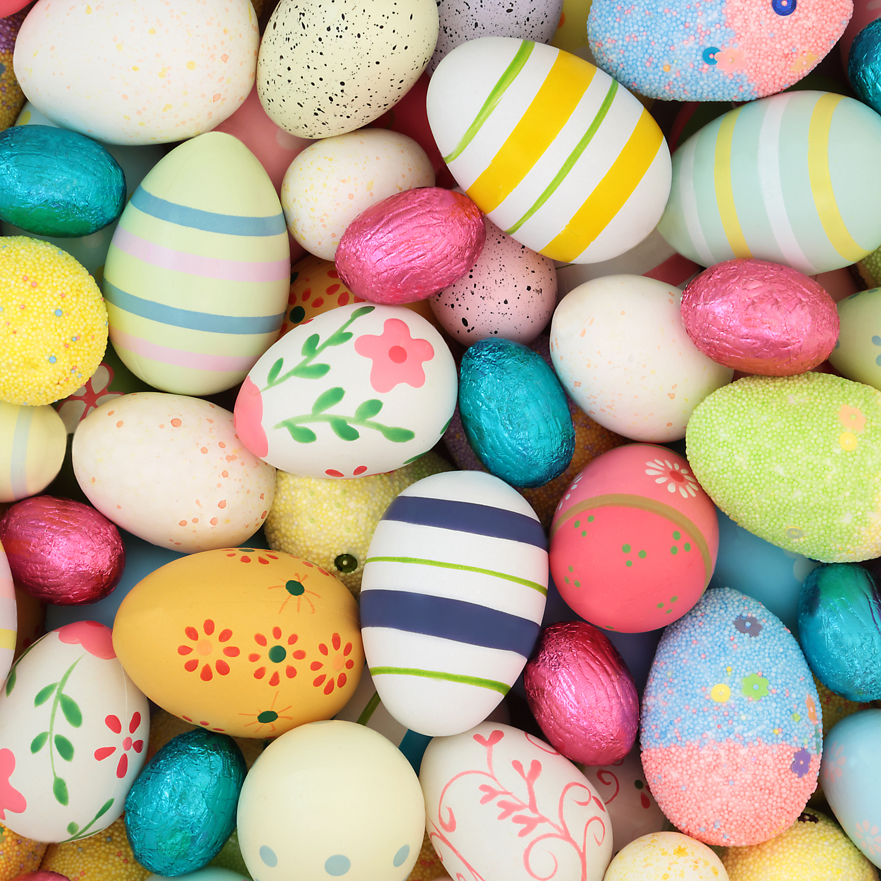 large collection of decorated and foil wrapped eggs